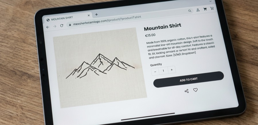 A tablet showing the shirt's product page, with price and an add-to-cart button.